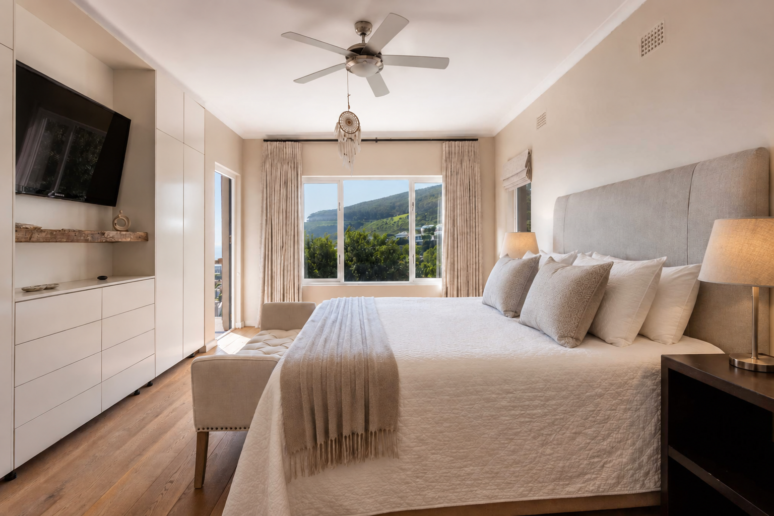 Bedroom opening onto a wooden terrace